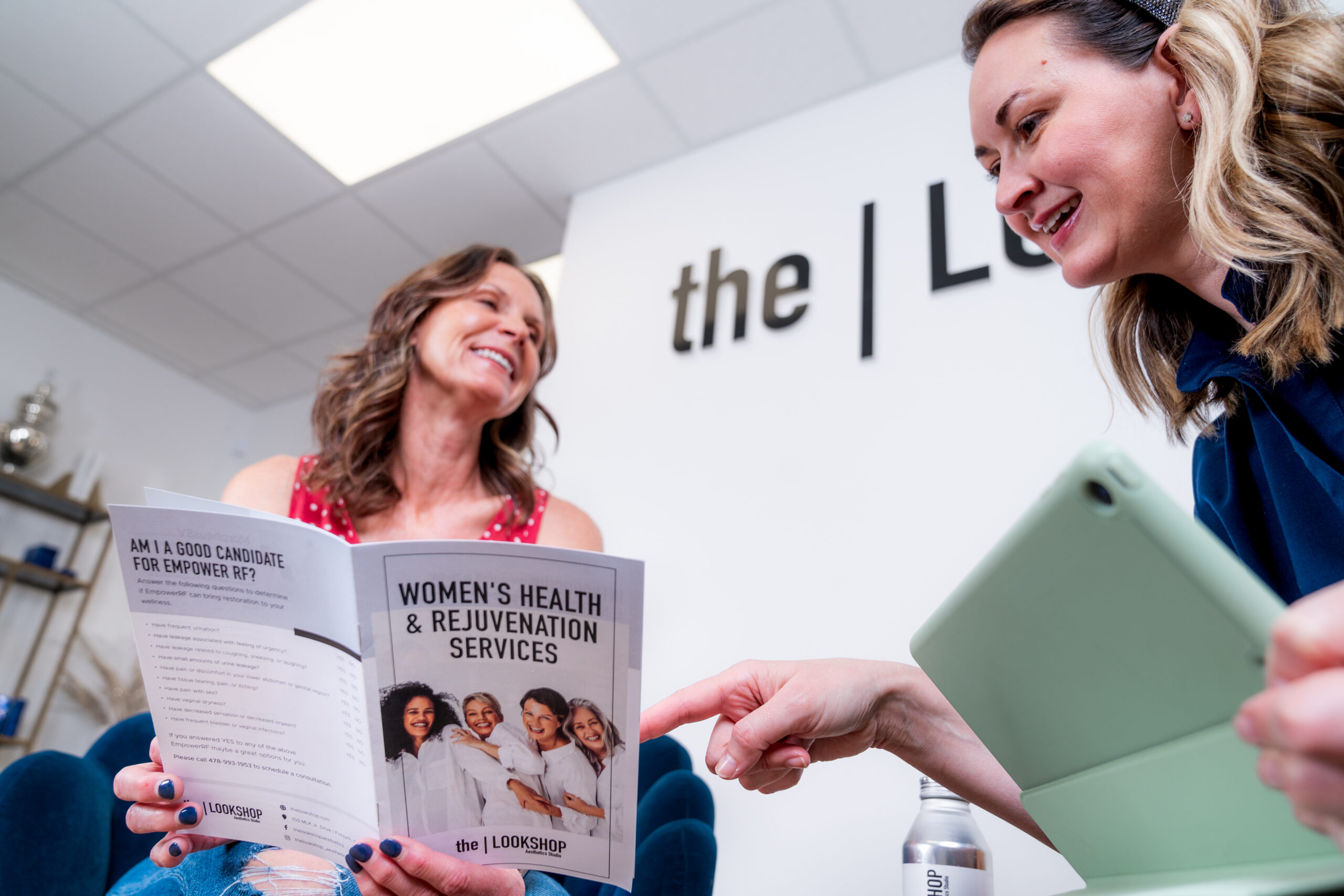 A patient reviews the women's health brochure at The Lookshop.